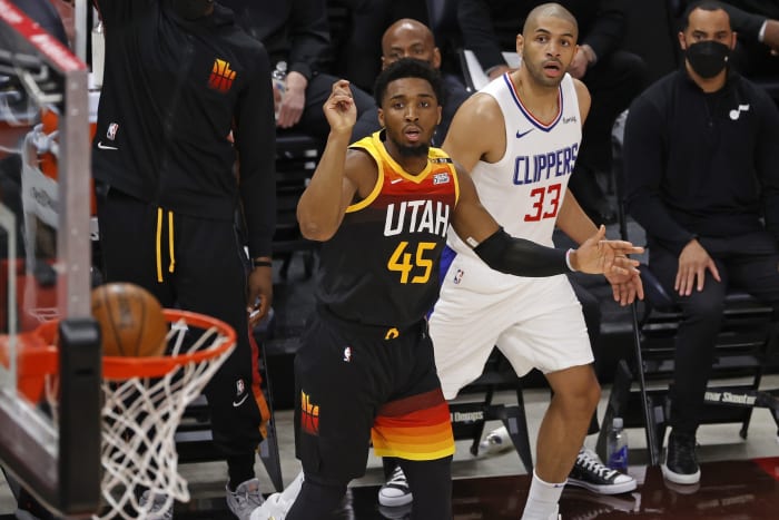 Donovan Mitchell (45) scores a three-pointer over Nicolas Batum (33) in game one of the Western Conference Semifinals